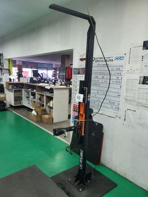 a machine that is sitting on a green floor in a room