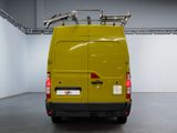 a yellow van that is parked in a garage
