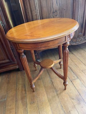 a wooden table with a wooden top on a hard wood floor