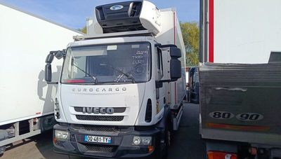 a truck that is parked next to another truck