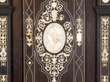 a large wooden door with a clock on it