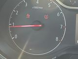 a close up of a car dashboard with a speedometer