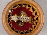a small clock that is on a table