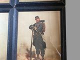 four framed pictures of men in military uniforms are hanging on a wall