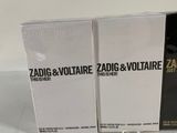 two boxes of zadig and voltare cologne sitting on a table
