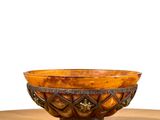 a bowl that is sitting on a wooden table