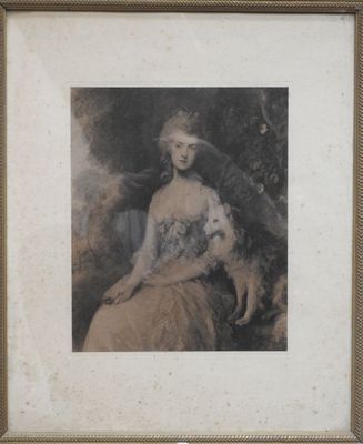 une vieille photo représentant une femme assise sur une chaise avec un chat