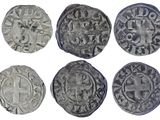 six types différents de pièces d'argent sont représentés sur un fond blanc