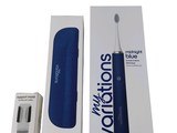 une boîte contenant une brosse à dents et une boîte contenant une brosse à dents