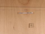 a picture of a piece of wood with a sticker on it