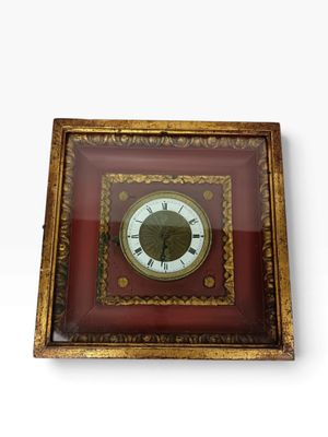 la photo d'une photo représentant une horloge dans un cadre