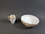 a cup and saucer sitting next to each other on a table