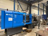 a blue machine that is sitting inside of a building