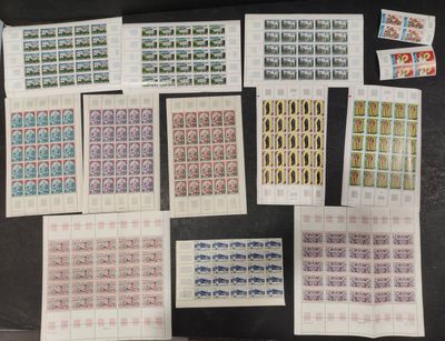 a table topped with lots of stamps and stamps on top of each other