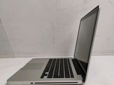 a laptop computer sitting on a table with a white background