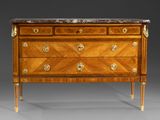 an antique chest of drawers with marble top