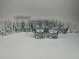 a lot of glasses that are sitting on a table