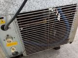 a heater that is sitting on the floor next to a wall