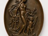 plaque en bronze représentant une femme et un chien, posée sur un socle