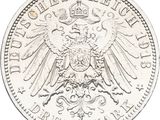 a close up of a silver coin with an eagle on it