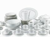a picture of a white table setting with a lot of plates and cups