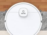 vue aérienne d'un aspirateur robot sur un parquet