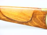 a close up of a rifle on a white background