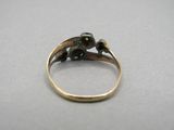 an image of a gold ring with an elephant on top of it