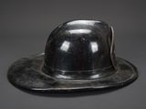 a silver hat that is sitting on top of a table