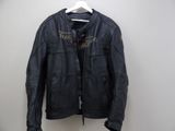 a black leather jacket hanging on a hanger on a wall