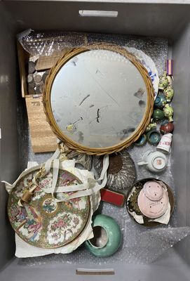 a box filled with assorted items and a mirror