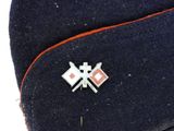an image of a hat with two crossed flags on it