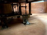 a close up of a machine on a wooden table