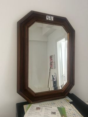 a mirror that is sitting on top of a table