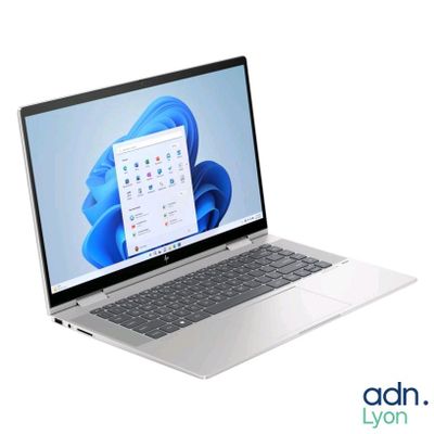 an open laptop computer sitting on top of a white surface