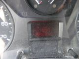 a close up of a car dashboard with a speedometer