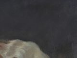 portrait of a woman with a cat by a painting on a black background