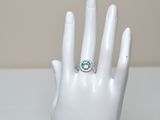 an image of a hand with a ring on it ' s finger