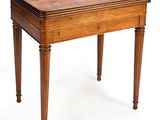a small wooden table with a drawer on it
