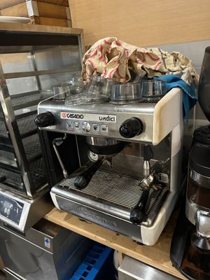 a coffee maker and a coffee maker on a shelf