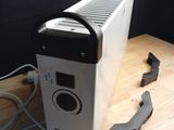 a white and black machine sitting on a wooden table