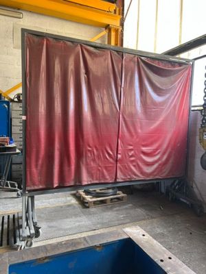 a red sheet covering a room with a blue pool