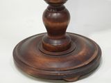a wooden candle holder on a white background