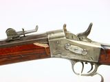 an old gun with a wooden handle on a white background
