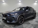 a grey 2020 infiniti is parked on a checkered floor