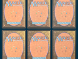 four decks of magic the gathering cards are shown on a blue background