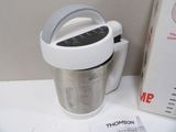 a blender that is sitting on a table next to a box