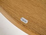 a wooden table with a sticker on the top of it