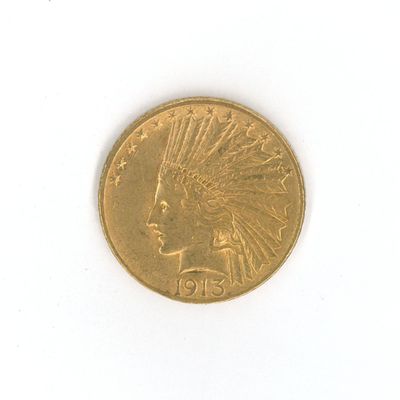 une pièce d'or sur laquelle est représentée une tête d'Indien
