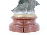 statue of a shark on a marble base on a white background